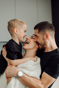 Happy family playing and laughing together at home