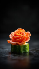 A close-up photo of a rose petal garnish on top of a cucumber slice, perfect for a keto diet presentation.