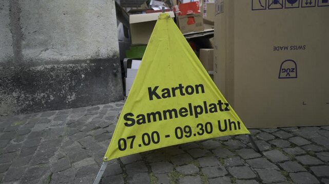 Karton sammelplatz Schweiz. Well-organized cardboard recycling point in Schaffhausen, Switzerland. Sustainable waste management and eco-friendly. Karton Sammelstelle in Altstadt. Recycling. 