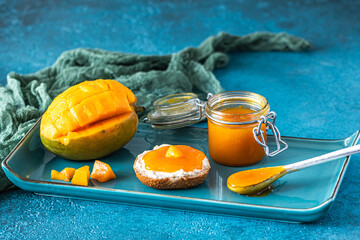 Homemade mango chuntney on a blue background