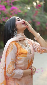 Elegant Woman in Traditional Indian Salwar Kameez Posing Outdoors