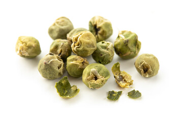 Green peppercorns isolated on white background. Pile of green peppers macro.