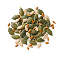 Pumpkin, sunflower, flax seeds mix isolated on white background. Mixed Seeds with clipping path. Top view.