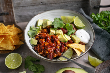 Vibrant and appetizing Mexican-inspired bowl with fresh avocado, chili, rice, and lime — perfect for promoting healthy, colorful cuisine and gourmet meals