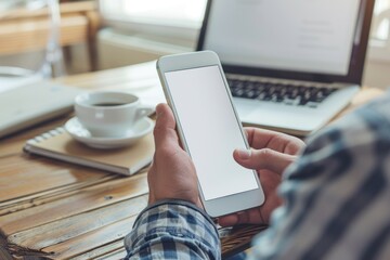 Latin indian adult student holding using mock up of cell mobile smartphone with empty blank white screen for advertising. Over shoulder closeup view.