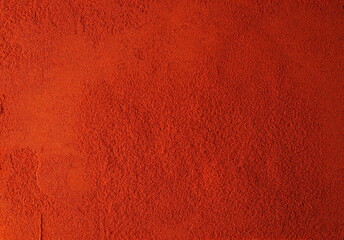 Red paprika powder background and texture, top view