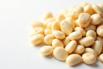 Close-up of dry white beans against a pure white backdrop, vegetarian, diet, scattering
