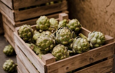 Fototapeta premium A wooden crate filled with green artichokes