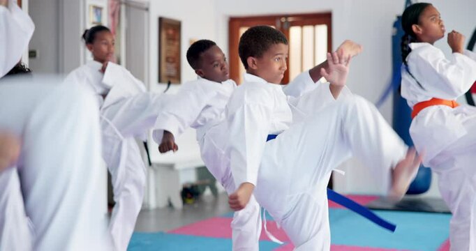 Kids, karate and class with fighting kata for self defense training, taekwondo or martial arts. Children, learning and practice session with kicking and punching for sport or lesson in aikido dojo