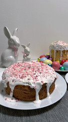Deliciously decorated cake with icing and colorful sprinkles alongside festive bunnies and Easter eggs creating a joyful celebration atmosphere for spring festivities concept
