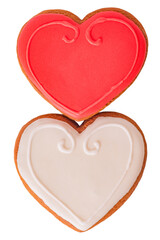 Gingerbread cookies in the shape of hearts, white and red, isolated on white.