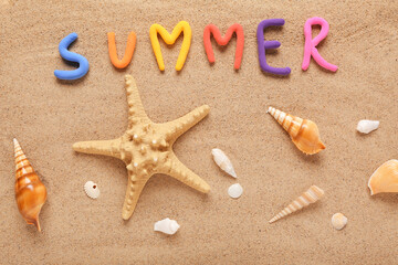 Word SUMMER with starfish and seashells on sand background