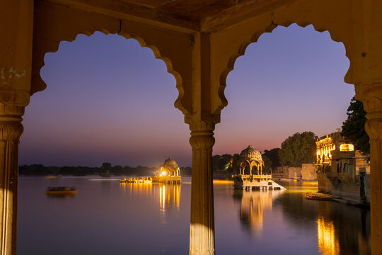 An elevated dome pavilions in the middle of Gadisar lake, Rajasthan, India shot during twilight