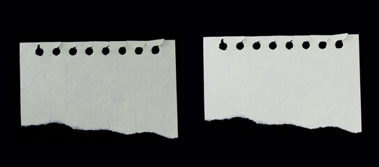 Trozos de papel blanco roto sobre fondo negro	