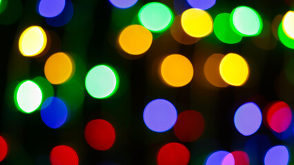 Multicolored Abstract Bokeh Lights Featuring Yellow Green Blue Red Orange Circles on Dark Festive Background