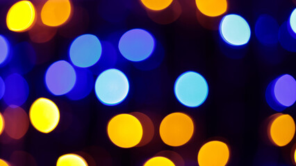 Multicolored Abstract Bokeh Lights Featuring Yellow Green Blue Red Orange Circles on Dark Festive Background