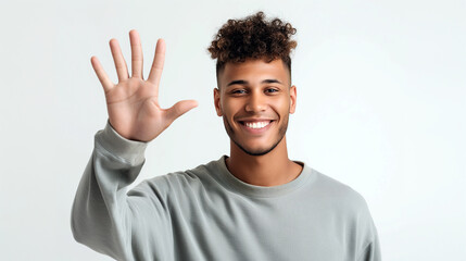 Fototapeta premium portrait of african american man showing palm with five fingers spread on plain light background, abstract on the topic 5 points