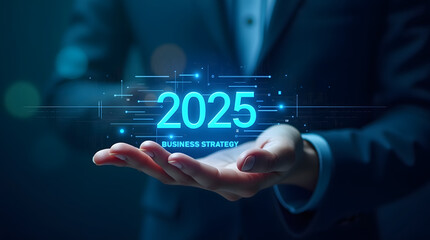 A business professional showcases a futuristic vision of '2025 Business Strategy' with glowing graphics in a modern setting.