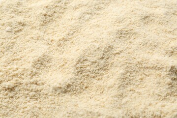 Superfood product. Sesame seeds powder as background, closeup
