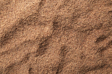 Superfood product. Flaxseed powder as background, closeup
