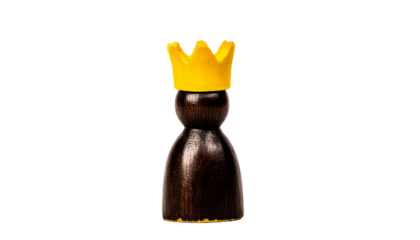 a chess king piece wearing a golden crown. The figure embodies power, authority, and strategy