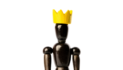 a wooden mannequin crowned in golden