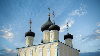 Stunning domes of a Russian Orthodox Church against a vibrant sky at dusk