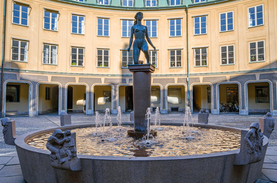 STOCKHOLM, SWEDEN - JULY 25, 2014: Bronze sculpture "Morgon" made by Ivar Johnsson in 1962, located in Brantingtorget ("Square of Branting"), the courtyard of Chancery House annex in Stockholm, Sweden
