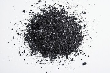 A pile of black powder on a white background