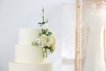 Delicious wedding cake with floral decor indoors, closeup. Space for text