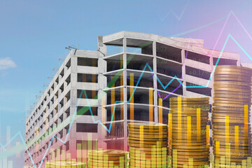 Rising real estate prices. Unfinished building, coins and graphs, multiple exposure