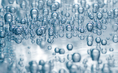 Soda water with bubbles in glass, closeup