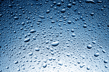 Many water drops on glass surface, closeup