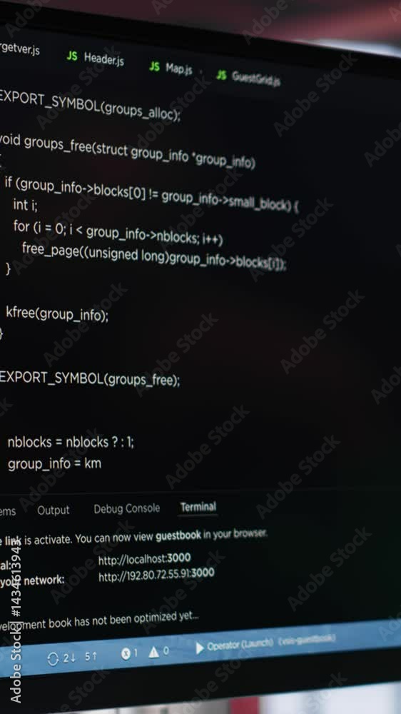 Fototapete Vertical Video Young IT engineer typing code on computer and running script, programming language. African american technician in modern loft fixing errors within the software, implementing features