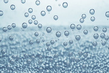 Soda water with bubbles as background, closeup