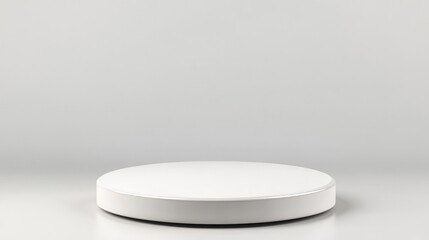 Empty white circular podium against a neutral background.