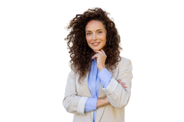 Confident businesswoman crossing arms, displaying professional demeanor against neutral background, smiling assertively