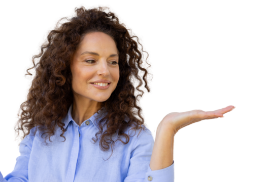Cheerful businesswoman with curly hair showing open hand palm, offering something on transparent background