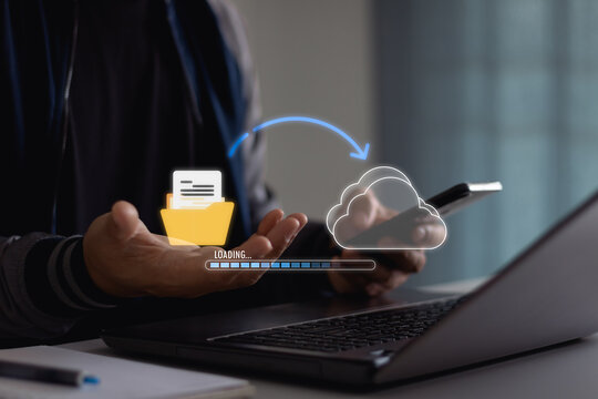 Transfer files data system relocation on cloud system technology concept. Business man hand using laptop computer waiting for AI transfer document file process with loading bar icon on virtual screen.