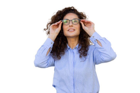 Professional woman with curly hair pushing glasses up, gazing inquisitively against transparent backdrop - Powered by Adobe