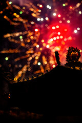 the roof of an ancient temple appears solemn and serene in the night
