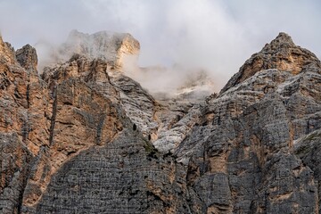 Misty rocky peaks in Dolomites, Italy