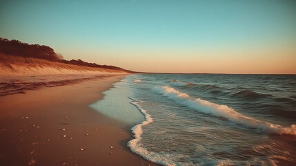 Sunset Beach Scene Ocean Waves Gently Rolling Ashore on Sandy Shore