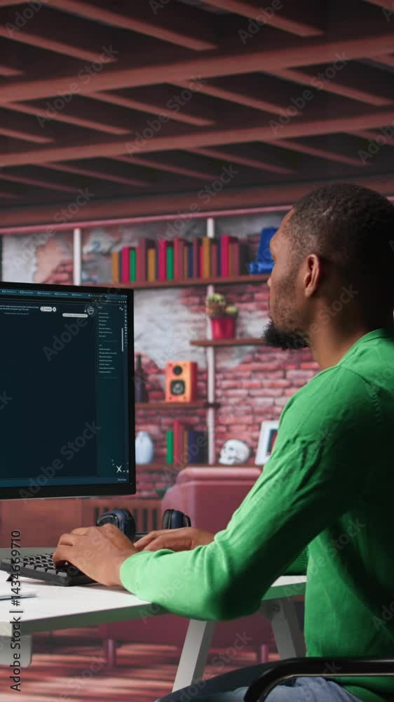 Fototapete Vertical Video African American worker using generative AI program with photos in a modern loft. Young man creating visual content with deep learning models and prompts on monitor with AI interface