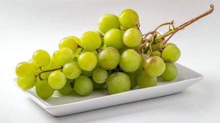 Fresh Green Grapes on a White Plate