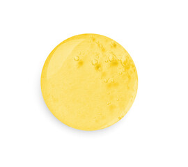 Drop of golden serum on white background