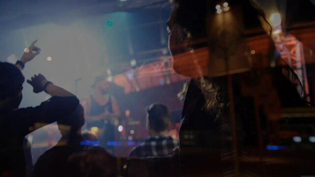 Male fan headbanging in music concert venue, with animated sound waves and glowing stage lights