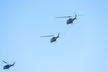 Military Helicopters Flying in Tight Combat Formation