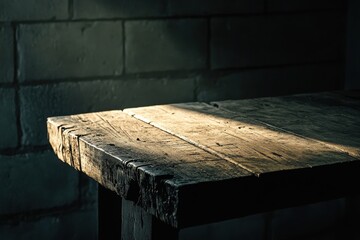 Rustic wooden table illuminated by a shaft of sunlight.