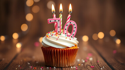 70th birthday cupcake with whipped cream, sprinkles, candles, and number 70, on wooden background with bokeh lights
